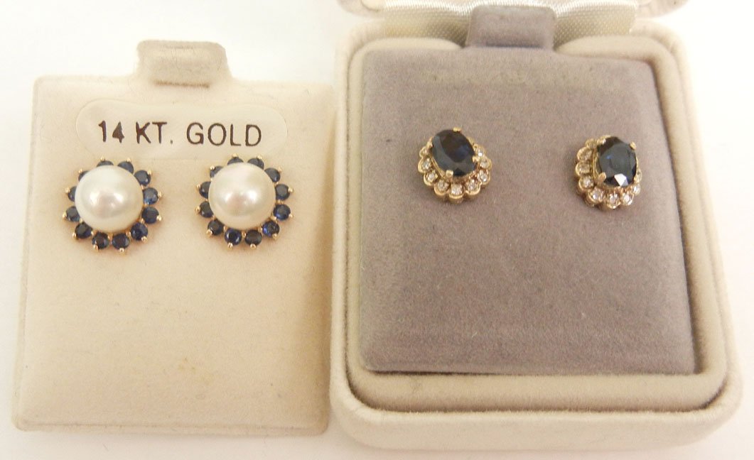Two pair of gold and sapphire post earrings including o