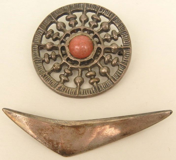 Two Scandinavian modern sterling silver pins including : Two Scandinavian modern sterling silver pins including Hans Hansen boomerang pin, 3" long, marked 925S Hans Hansen Denmark 113, and one David Andersen circular with pink stone, 1 7/8" diameter, marked