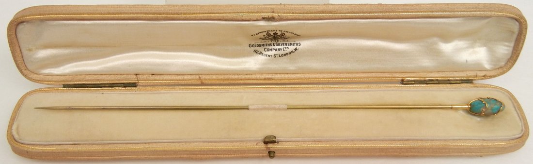 Gold and turquoise hat pin, 9k gold top with oval turqu: Gold and turquoise hat pin, 9k gold top with oval turquoise in handmade mounting, top is 5/8" long, total length 7 3/8", marked 9Ct. M.R. & Co., velvet and satin lined box from The Goldsmiths & Silver