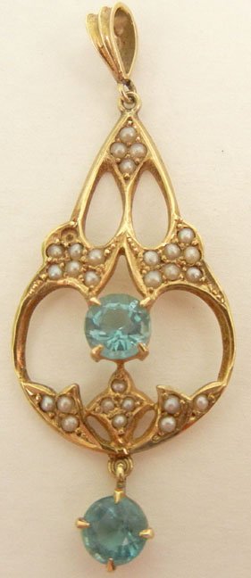 Gold lavaliere with blue zircons and seed pearls, 14k g: Gold lavaliere with blue zircons and seed pearls, 14k gold, pendant measures 1 3/4" long and is set with one zircon measuring 4.5mm in diameter, surrounded by seed pearls, one round zircon drop measur