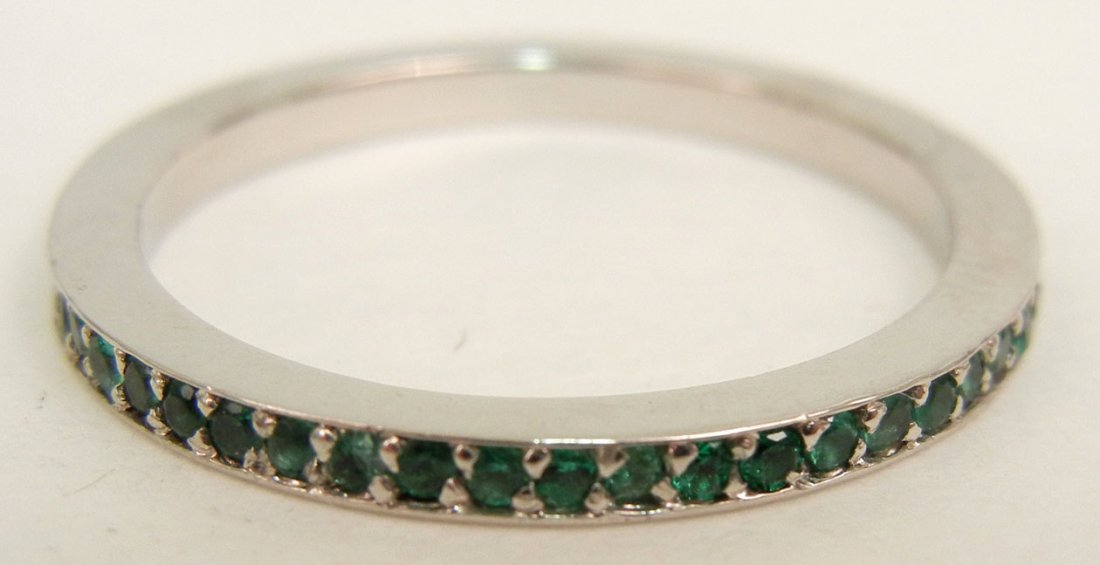Emerald and platinum eternity band, set with forty nine