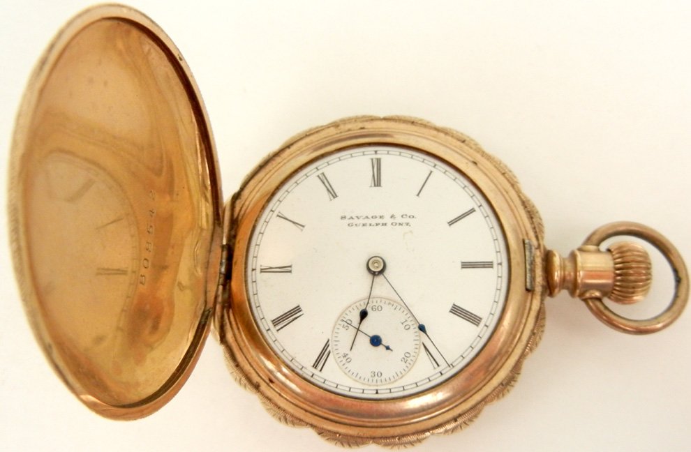 Savage and Company 14k gold cased pocket watch, engrave: Savage and Company 14k gold cased pocket watch, engraved hunting case, scene on back of cottage, lake and mountains, 1 3/4" diameter, number on works 5504892, Roman numeral dial, face and works marked