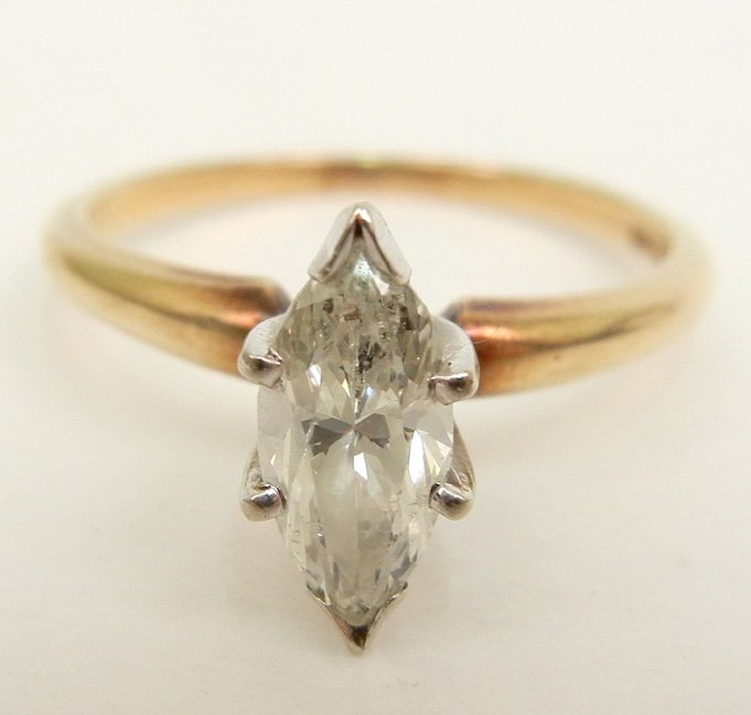 Diamond solitaire engagement ring, one marquise shaped : Diamond solitaire engagement ring, one marquise shaped diamond measuring approximately 80 points, 14k yellow gold mounting, marked 14k J.S.S., size 7 3/4, weight 2.8 grams/1.8 dwt, mid 20th C.