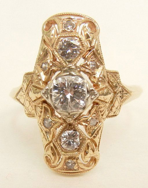 Art Deco gold and diamond ring, 14k yellow gold mountin: Art Deco gold and diamond ring, 14k yellow gold mounting, one center stone measuring approximately 40 points, two 10 point stones, marked 14k, size seven, weight 3.4 grams/2.2 dwt, early 20th C.