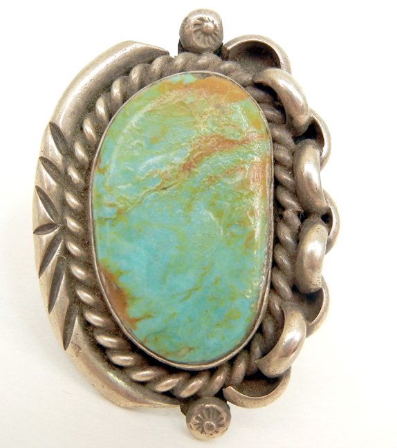 Native American handmade sterling silver and turquoise : Native American handmade sterling silver and turquoise ring, Navajo, one oval light green turquoise, light matrixing, twisted rope edge bezel with chain link motif on one side and stamp work on opposi