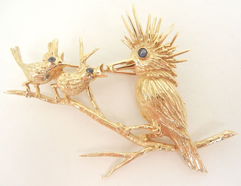J.E. Caldwell gold bird pin, 14k gold, mother bird feed: J.E. Caldwell gold bird pin, 14k gold, mother bird feeding to babies on tree branch, all with blue sapphire eyes, 2 7/8" long x 2 1/8" high, marked 14k J.E.C. & Co., weight 18.9 grams/12.1 dwt, mid 20