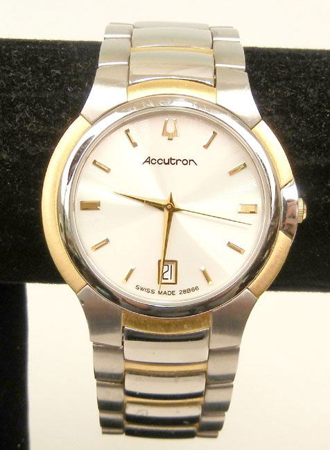 Man's Bulova Accutron wristwatch, stainless steel case : Man's Bulova Accutron wristwatch, stainless steel case and two tone band, case measures 1 3/8" in diameter, 7 3/4" long, sapphire crystal, number 28B66, late 20th C.