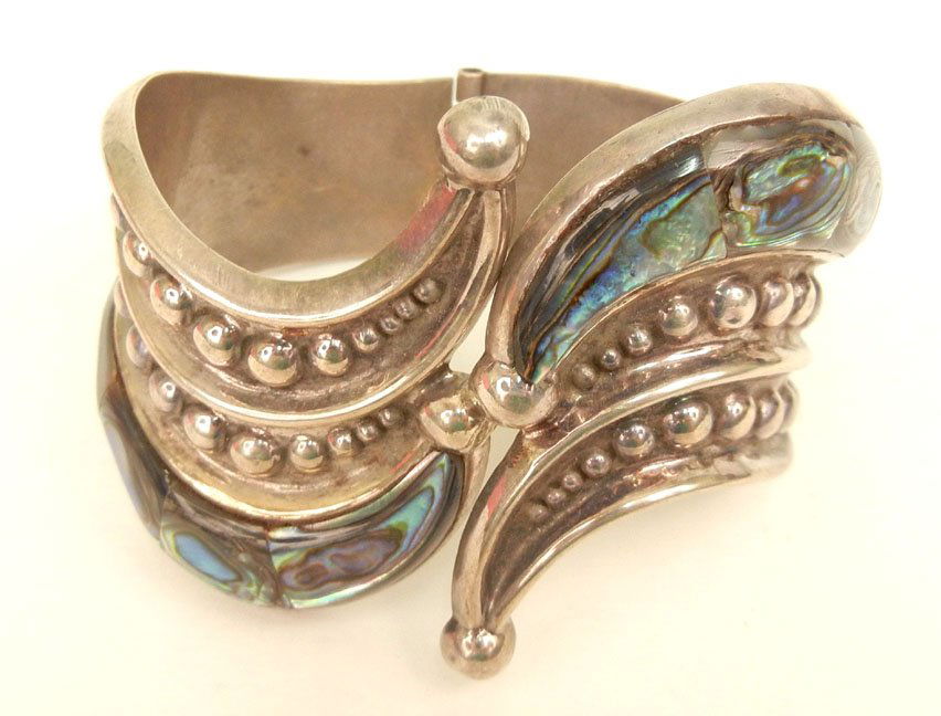 Mexican handmade sterling silver and abalone clamper st: Mexican handmade sterling silver and abalone clamper style hinged cuff bracelet, 2 1/4" wide at center, 4 5/8" inside diameter, marked 925 Mexico TS-45, weight 62.2 grams, mid 20th C.