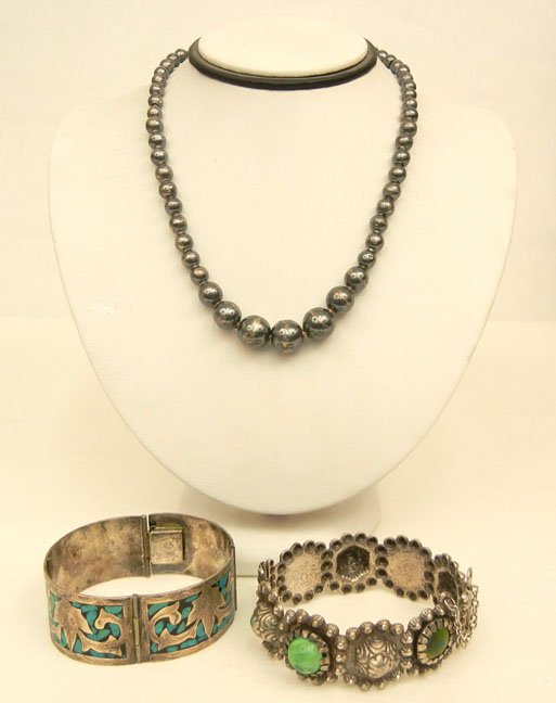 Two Mexican handmade sterling silver bracelets and a be: Two Mexican handmade sterling silver bracelets and a beaded necklace, one bracelet with turquoise inlay on black background, four hinged sections, 7" long x 1" wide, marked Mexico 925 Guadalajara, J.S