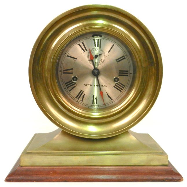 Seth Thomas brass ship's clock, mounted on wooden base,: Seth Thomas brass ship's clock, mounted on wooden base, 11 1/2" x 11 1/2" x 6 1/4"