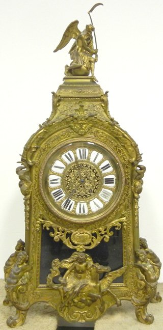 Tiffany & Co. bronz mantle clock, Father Time finial, c: Tiffany & Co. bronze mantle clock, Father Time finial, caryatid feet, woman riding Pegasus at bottom, dolphins at mid-section flanking face, dial with enameled Roman numerals, late 19th C., 43" high x
