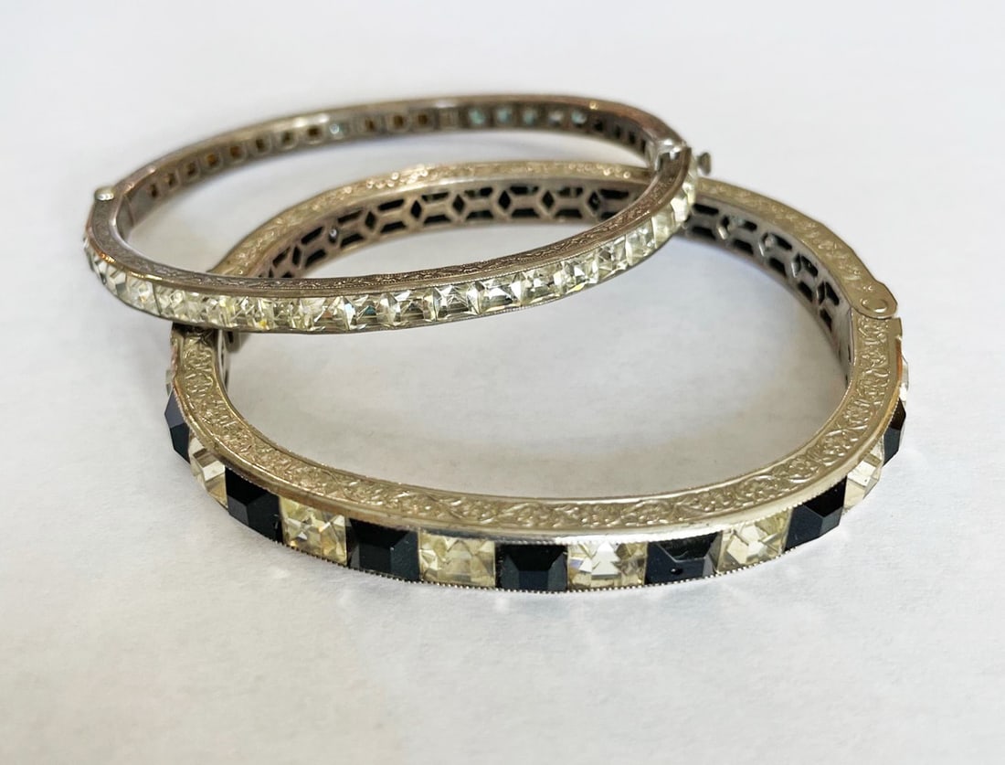 Two Art Deco Sterling Silver Rhinestone Bracelets: Two Art Deco sterling silver rhinestone bracelets, one wider bracelet with alternating clear and dark blue stones,1/4" wide, inside circumference is 6 3/4", stamped sterling; and one bracelet 3/16"