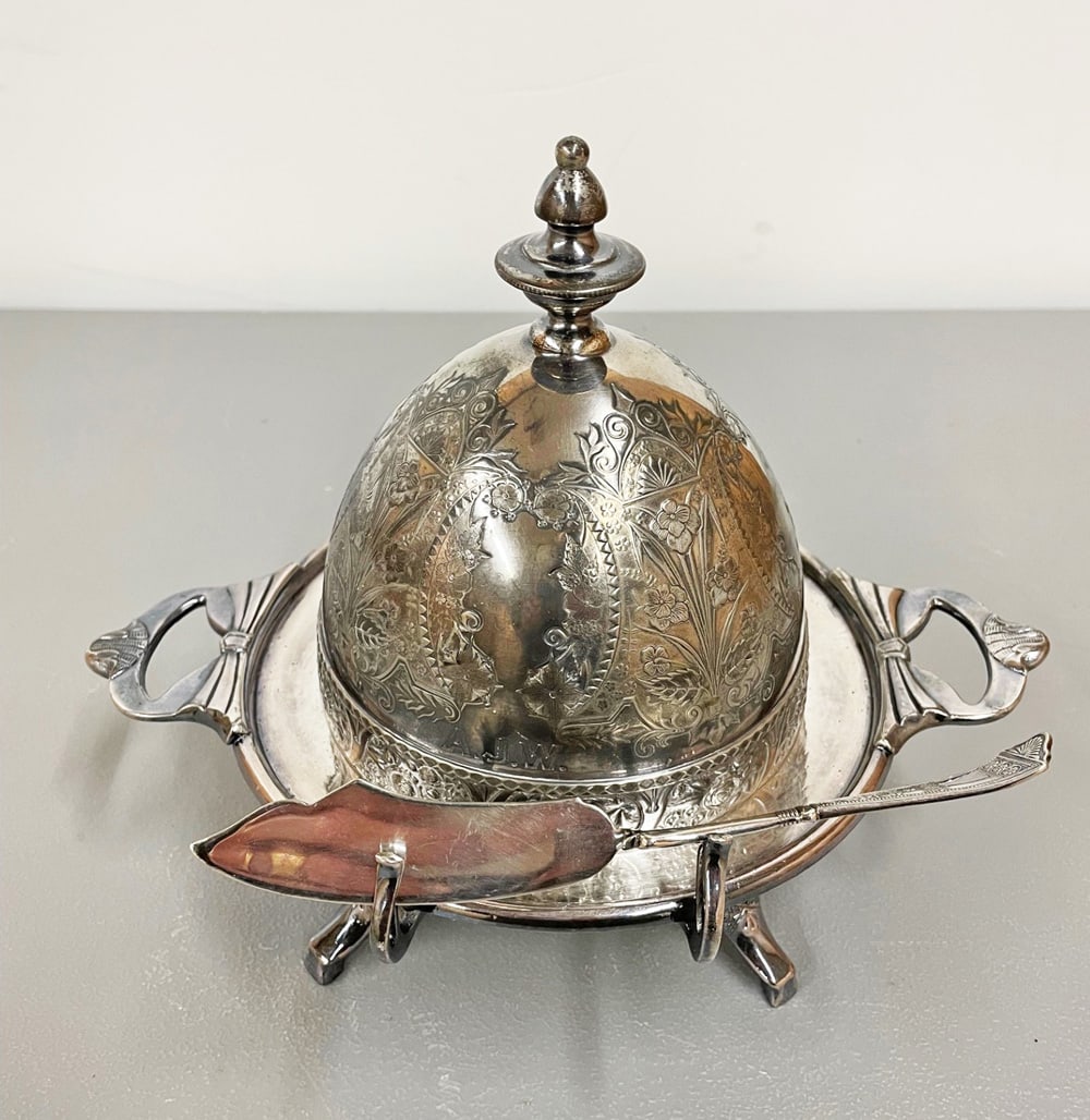 Silver Plated Covered Butter: Wilcox Silver Plate late Victorian covered butter with glass and plated insert, stylized floral chased and raised decoration, 8 1/2" high x 10" x 8", with butter knife