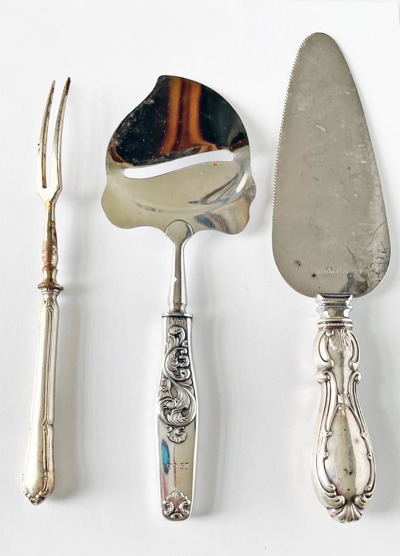 Three Sterling Handled Serving Pieces: Three sterling handled serving pieces, includes cake cutter 9 1/2", olive fork 8 1/4", and Norway sterling cheese slicer dated 1966, monogrammed M, 8 1/2"