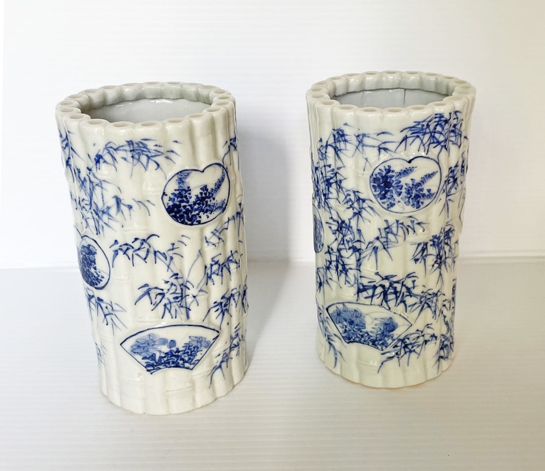Pair of Japanese Meiji Period Vases: Pair of Japanese Meiji period vases, blue and white porcelain in cylindrical bamboo form, decorative motif of fronds and fans, unmarked, 6" high