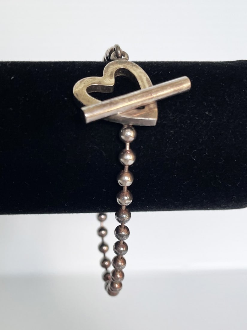 Gucci Sterling Silver Bracelet: Gucci sterling silver bracelet, bead chain bracelet with heart toggle clasp, 7 3/8" long, Signed Gucci, and stamped on back of heart Gucci Ag. 925 with Italian hallmarks and the number 17, weight 13.1