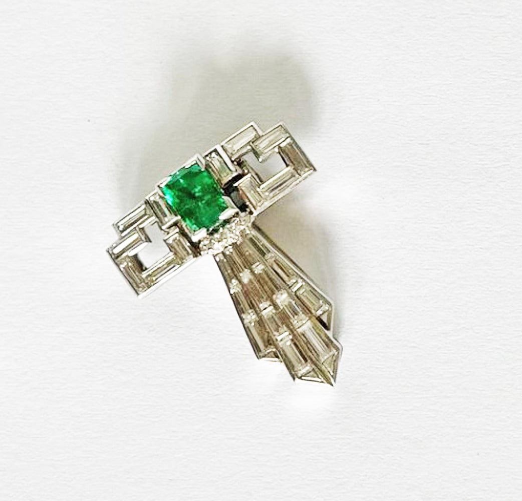 Art Deco14k White Gold Diamond and Emerald Dress Clip: Art Deco 14k white gold diamond and emerald dress clip, T shaped clip with center emerald cut emerald measuring approximately 5mm x 4mm, twenty six diamond baguettes weighing approximately 1.72 carats