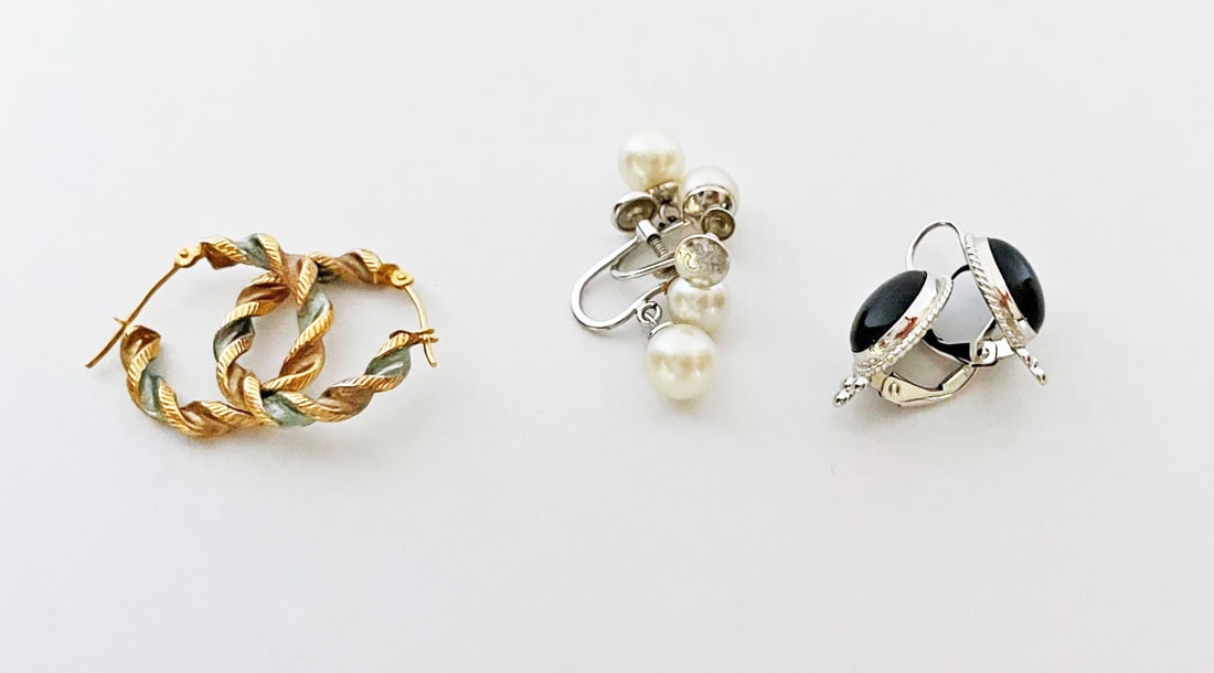 Three Pairs of Gold Earrings: Three pairs of gold earrings, includes 10k gold twist hoop pierced earrings with silver stripe, 3/4" diameter, stamped 10k S, 14k white gold black onyx lever back drop earrings, 3/4" long, stamped 14k