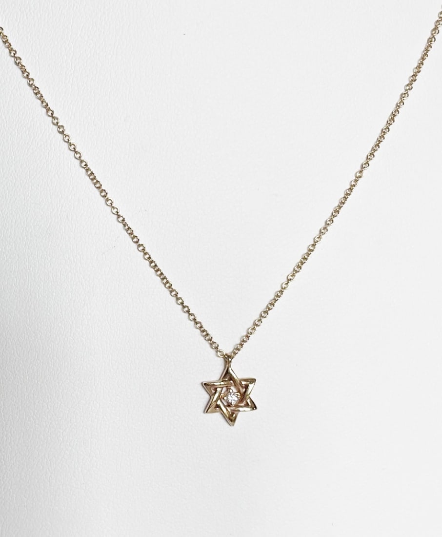 14K Gold and Diamond Star of David Pendant with Chain: 14K gold and diamond Star of David pendant with 18" 14k gold chain, pendant stamped 14K and signed, chain stamped 14k on clasp, 2.3 grams