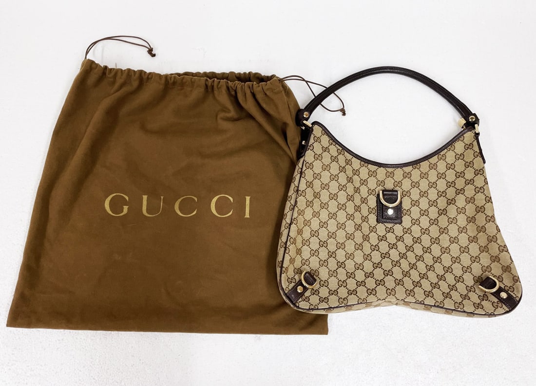 Gucci GG Abbey D-Ring Canvas Shoulder Bag: Gucci GG Abbey D-Ring Canvas shoulder bag, brown and beige monogram bag, leather strap, brass monogrammed hardware, zipper top, interior pockets, with dust bag, purse measures 15 1/2" x 15" x 2 1/2"