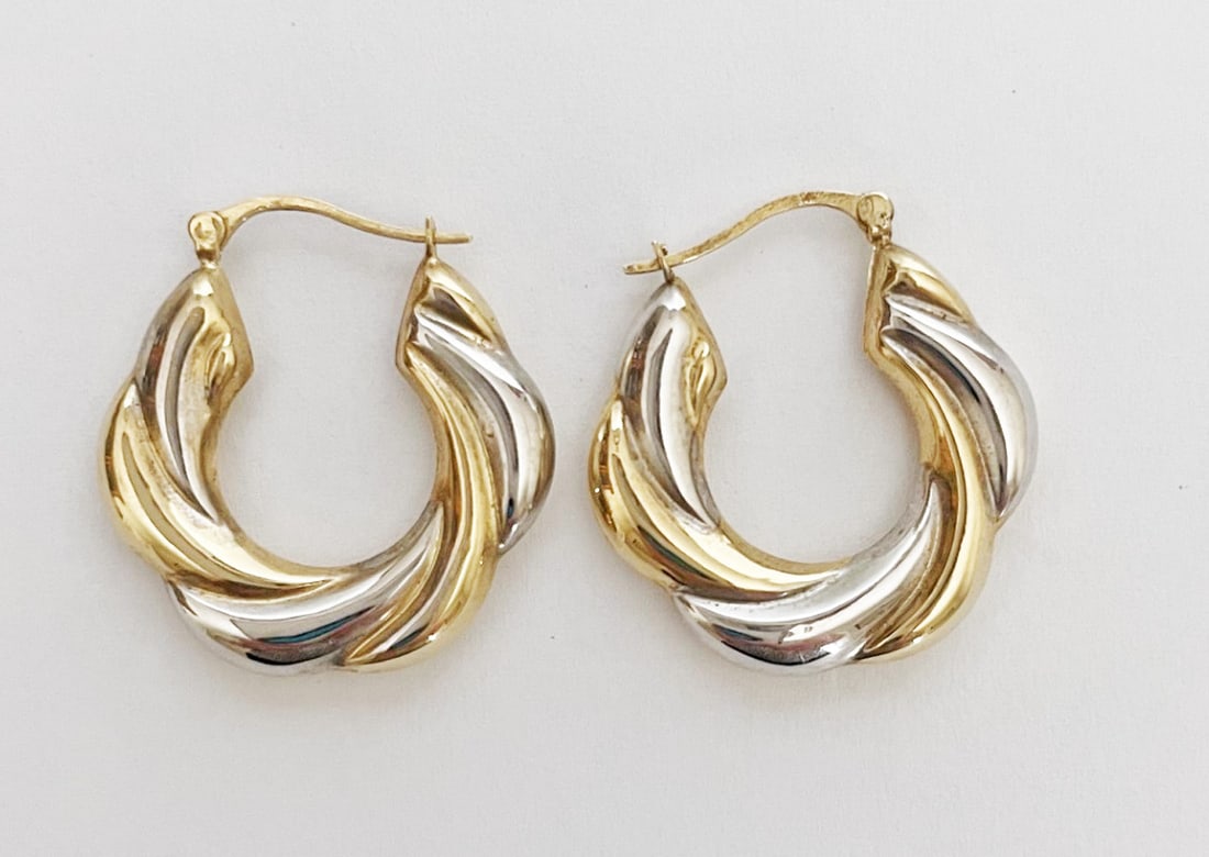 Two Tone 14k Gold Hoop Earrings: Two tone 14k gold hoop earrings, yellow and white gold on one side, and solid yellow gold on reverse, 1" long, stamped 14k, weight 2.5 grams