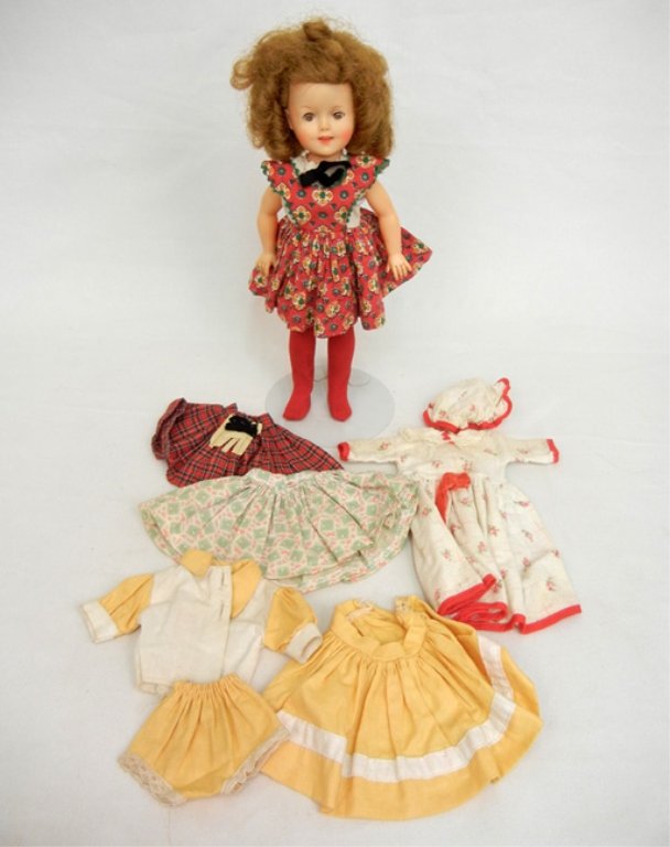 1950's Ideal Shirley Temple vinyl doll, with wardrobe,: 1950's Ideal Shirley Temple vinyl doll, with wardrobe, green sleep eyes, painted lashes, open mouth with teeth, some tagged clothing, marked on back of head, 12"