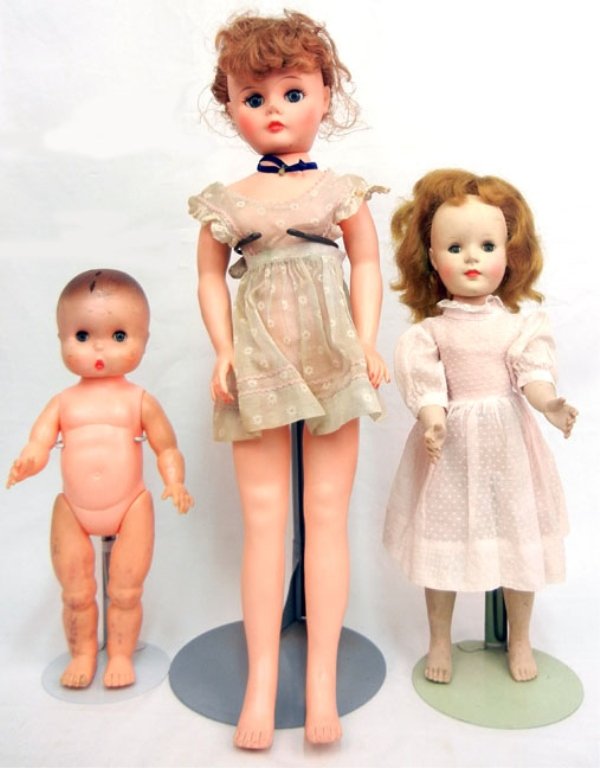 Grouping of three dolls, American Character Sweet Sue: Grouping of three dolls, American Character Sweet Sue walker, wearing pink dress, 17", large vinyl doll (originally pinafore), wearing blue dress, 24", and a nude imp 1960s doll by Jolly Toys Inc., 14