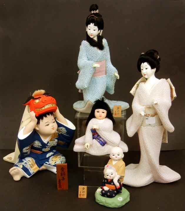 Five Global Art Japanese dolls, Hakata Doll: Five Global Art Japanese dolls, Hakata Doll Association, three are geisha women, plastic, styrofoam, and beading, and two ceramic, one of a man and woman, one of a man with dragon on head, all with la