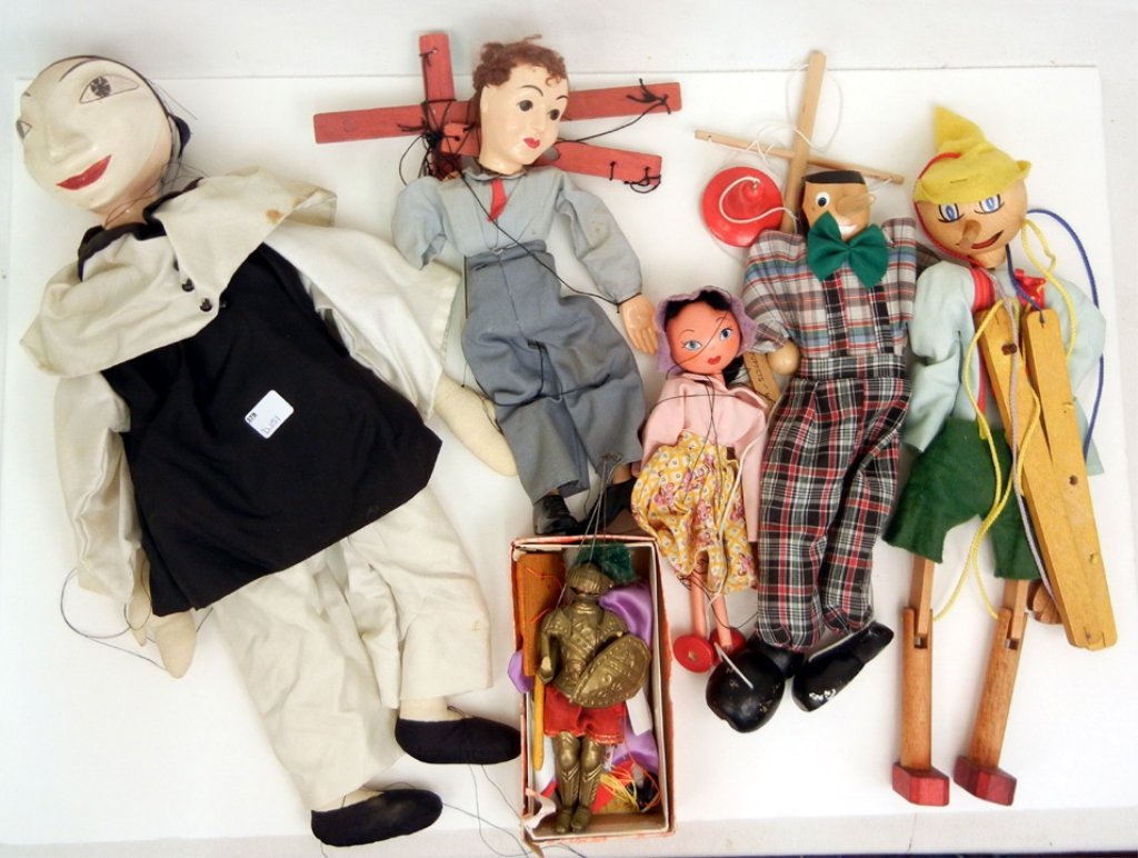 Grouping of seven marionettes, Pelham's and Hazelle's,: Grouping of seven marionettes, Pelham's and Hazelle's, including two Pinnochios, harlequin, knight, monkey king from China in box, and two women
