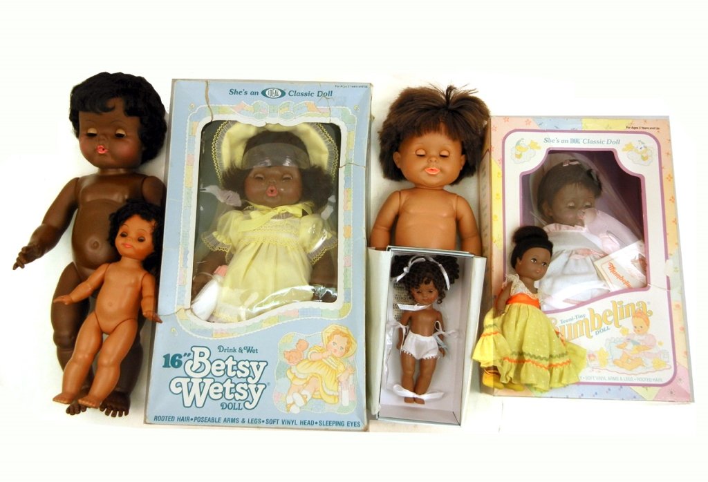 Grouping of black dolls, including two Ideal 16" Betsy: Grouping of black dolls, including two Ideal 16" Betsy Wetsy, one new in original box, Ideal 12" Thumbelina new in box, two Vogue Ginny, one new in original box, and two hard plastic dolls, one marked