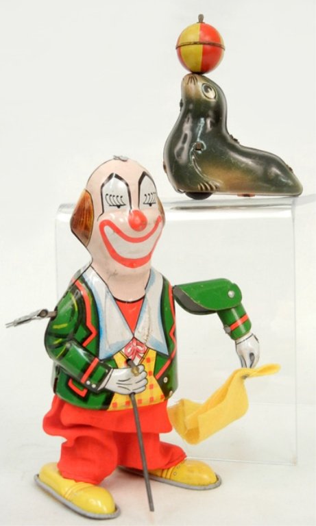 Lehmann AHA 910 tin litho seal, Made in Western: Lehmann AHA 910 tin litho seal, Made in Western Germany, 4", marked on bottom, and a Mikuni wind up clown, tin litho, marked on back "Trademark Mikuni, Made in Japan, 6 1/4"