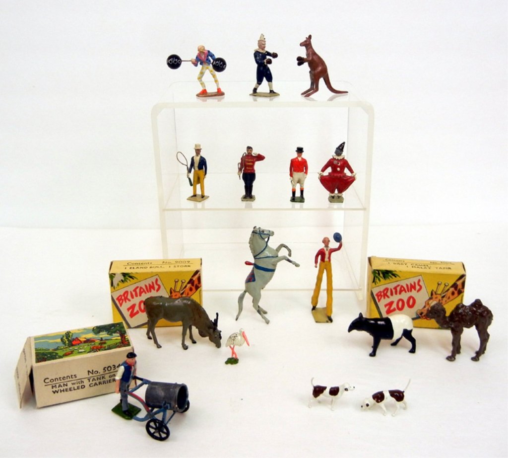 Diecast Britains circus figurines, including boxing man: Diecast Britains circus figurines, including boxing man and kangaroo, man on stiltz, clowns, ring masters, horse, two dogs, two boxes Britains Zoo animals, including No. 9009 one Eland Bull, one Stork