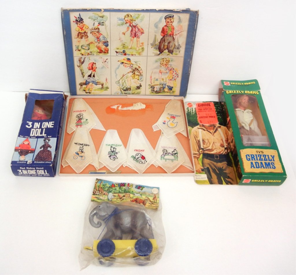 Grouping of toys, including Mattel Grizzly Adams, 3 in: Grouping of toys, including Mattel Grizzly Adams, 3 in one Doll Red Riding Hood and the Wolf, hand made handkerchiefs in box, with the days of the week on them, and a Animals Set plastic elephant Made