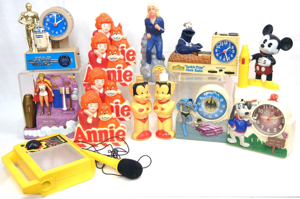 Grouping of toys, including Mickey Talking: Grouping of toys, including Mickey Talking Toothbrush, Batman Talking alarm by Janex Corp. Sesame Street "Cookie Time" clock radio, Pound Puppies talking alarm, four "Annie" radios, She-Ra talking too