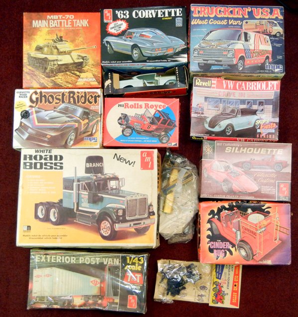 Grouping of scale model kits, including Revell: Grouping of scale model kits, including Revell VW Cabriolet, AMT Silhouette, AMT The "Cinder-Bug" Firetruck, MPC Ghost Rider, AMT White Road Boss, AMT Ford Lotus (not in box), Jo-han model car, MPC Ro