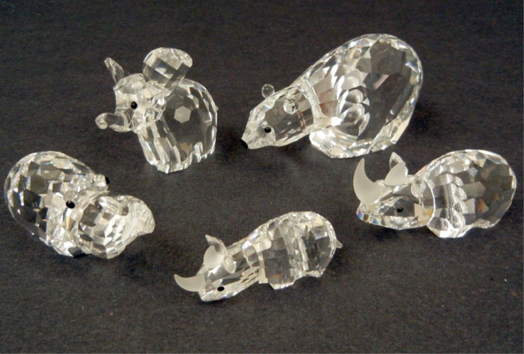 Grouping of five Swarovski crystal figurines, including: Grouping of five Swarovski crystal figurines, including polar bear, elephant, hippo, larger rhino, and smaller rhino, tallest is 2" high, all stamped