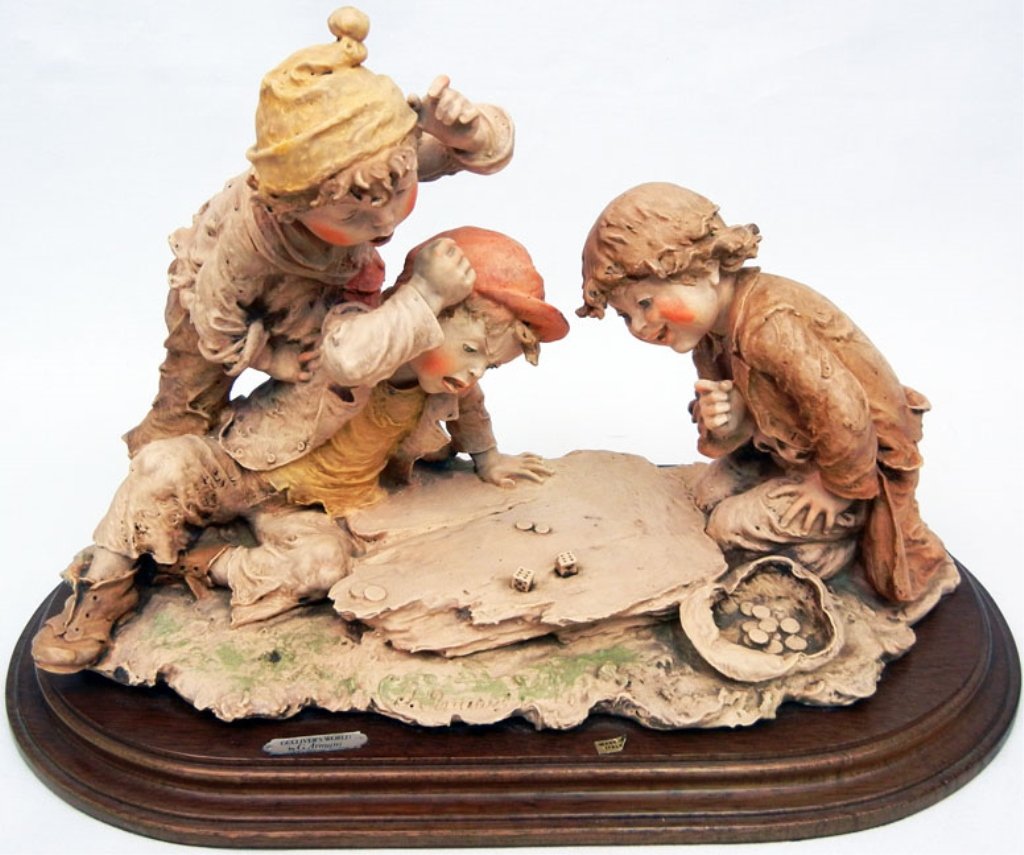 Giuseppe Armani figurine, Boys playing dice, Gulliver's: Giuseppe Armani figurine, Boys playing dice, Gulliver's World Collection, mounted on base, with plaque on front, Made in Italy sticker, signed on front, 9" high x 14 3/8" across x 8" deep