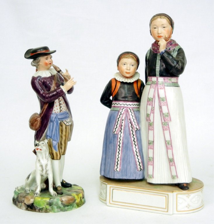 Two Royal Copenhagen porcelain figurines, #12105 Two Am: Two Royal Copenhagen porcelain figurines, #12105 Two Amager girls, 9 1/4" high; and #12148 man playing horn with seated dog at his feet, 7 1/2" high