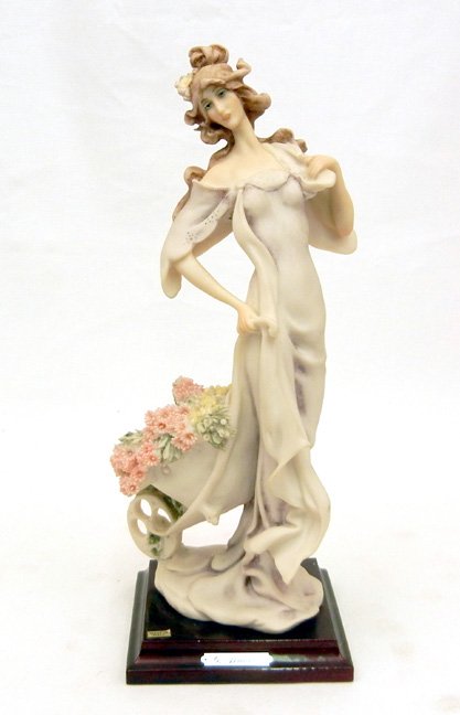 Giuseppe Armani figurine, Lady with Wheelbarrow, mounte: Giuseppe Armani figurine, Lady with Wheelbarrow, mounted on base, plaque on front, signed on back, 11 1/4" high