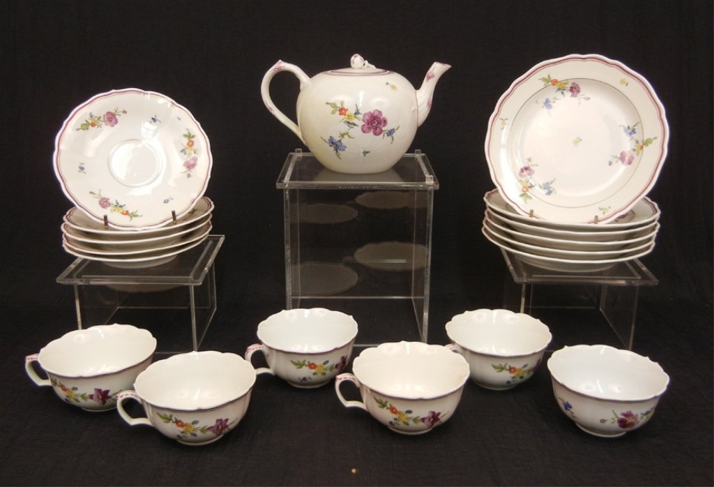 Meissen partial dessert set, polychrome floral decorati: Meissen partial dessert set, polychrome floral decoration, set includes 4 1/2" high teapot, six 2" teacups, five 6" saucers, and six 7" plates, all with crossed swords blue underglaze mark on bottom,
