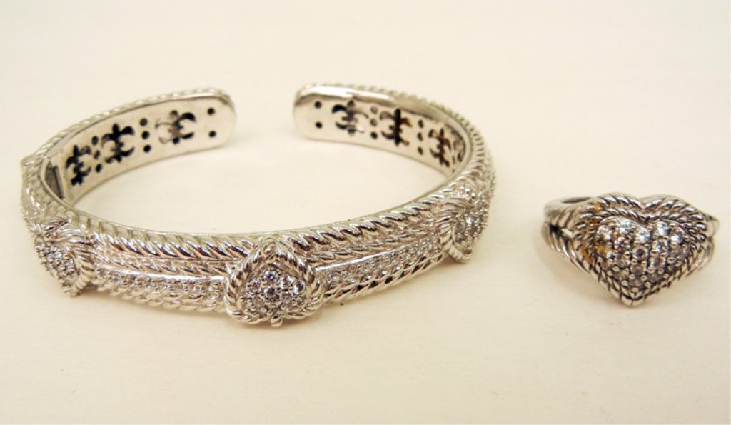 Judith Ripka sterling silver and C.Z. heart motif cuff : Judith Ripka sterling silver and C.Z. heart motif cuff bracelet and ring, inside dimensions of bracelet and 2 1/2" long x 2" wide with 1/2" opening, 1/2" wide at center, ring has pave set C.Z.'s in he