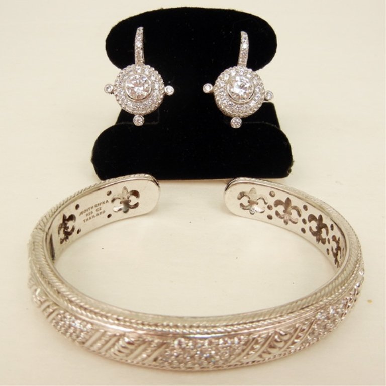Judith Ripka sterling silver and C.Z. hinged cuff brace: Judith Ripka sterling silver and C.Z. hinged cuff bracelet and drop earrings, inside dimensions of bracelet are 2 1/2" long x 2" wide with 1/2" opening, 1/2" wide at center, pierced earrings have Omeg