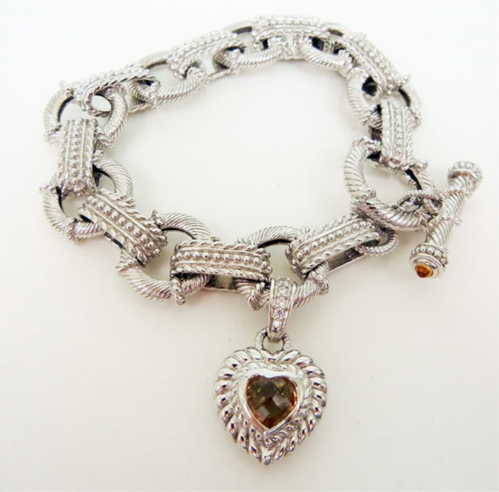 Judith Ripka sterling silver toggle bracelet with heart: Judith Ripka sterling silver toggle bracelet with heart charm, alternating oval and round textured links, 8 1/2" long x 5/8" wide, heart charm with faceted citrine colored stone, charm is 1" long, mar