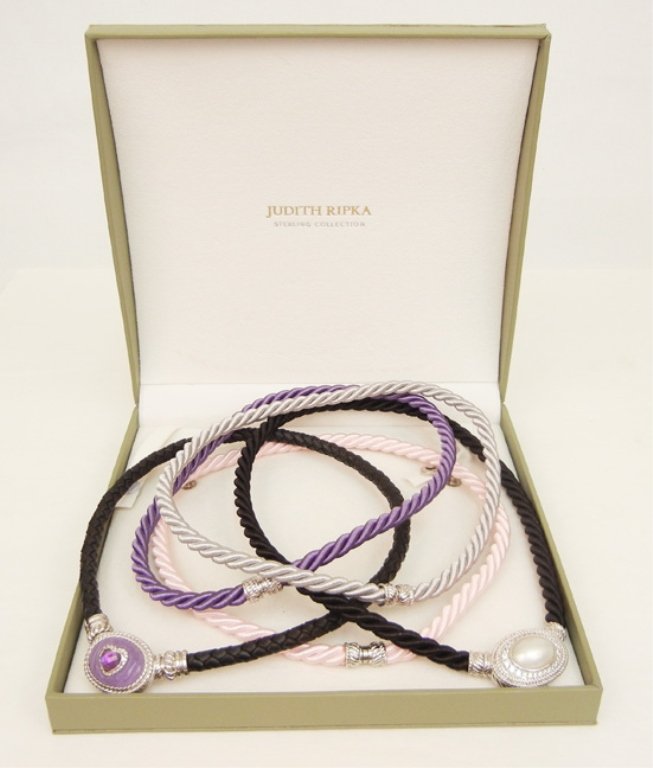 Set of Judith Ripka sterling silver & magnetic pendants: Set of Judith Ripka sterling silver & magnetic pendants with cords, one pendant with pearl center surrounded by C.Z.'s and one with faceted lavender stone set with faceted amethyst heart, pendants are