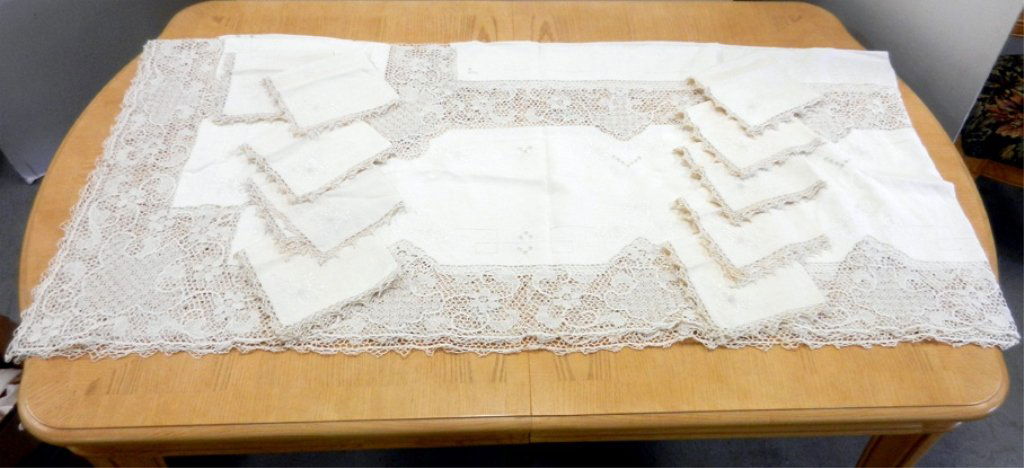 Linen tablecloth and napkins set, crocheted border and : Linen tablecloth and napkins set, crocheted border and inset panels, 11' 4" long x 5' 4" wide, hand embroidered, matching napkins are 18" x 18", early 20th C.