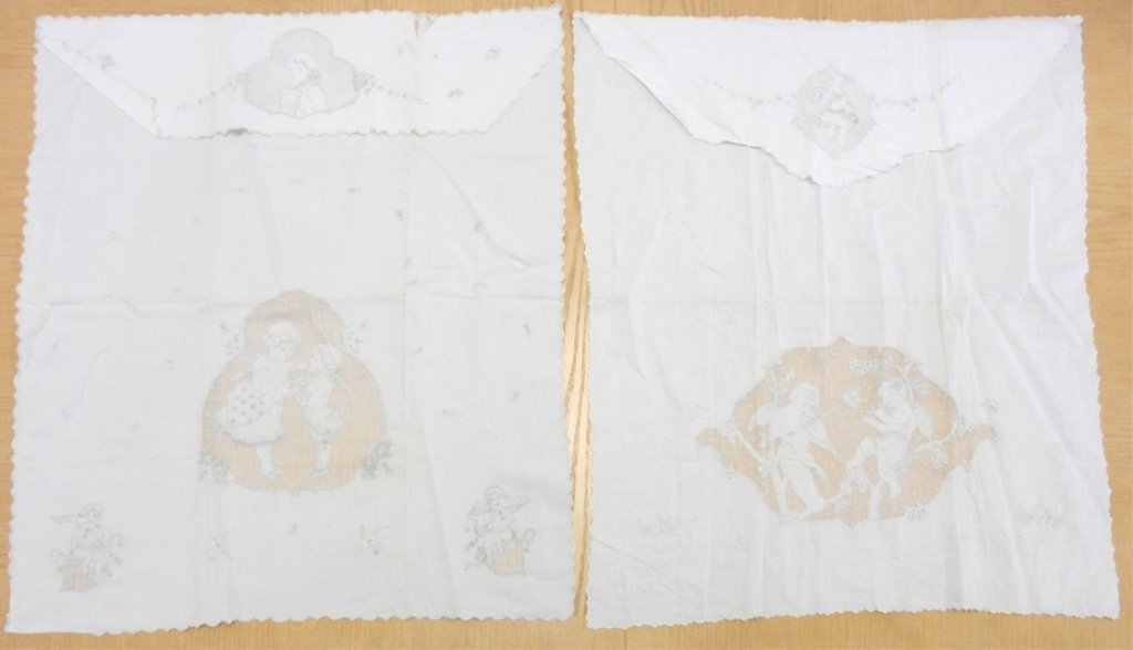 Two linen hand embroidered crib sheets, both 30" long x: Two linen hand embroidered crib sheets, both 30" long x 26" wide, one with embroidery of children, flowers and cherubs in corners, one with embroidered cherubs, early 20thC.