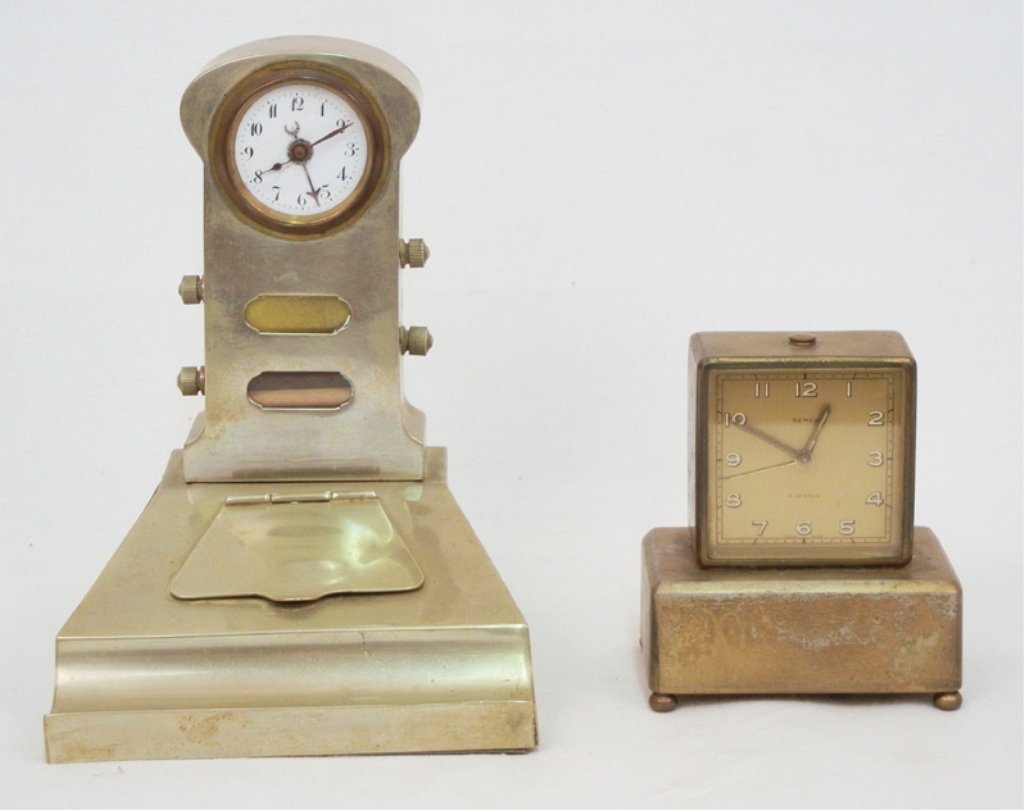 Two desk clocks including Wecker clock with inkwell, br: Two desk clocks including Wecker clock with inkwell, brass plated, 6 1/2" x 5" x 5 1/4", and a Semca clock, 4 jewels, Swiss made, with ball feet, musical, partial label on bottom, 3 3/4" x 3 3/4" x 2 