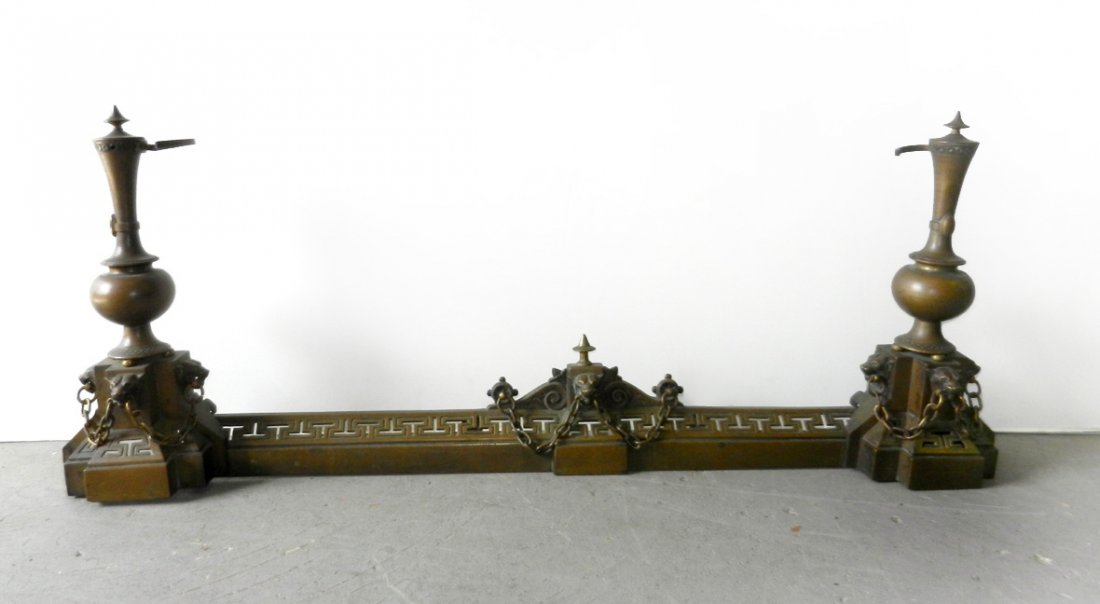 French bronze fireplace fender, dog head and chain deco: French bronze fireplace fender, dog head and chain decoration, with pierced stylized Greek key design, 19th C., 17" x 39" x 6"