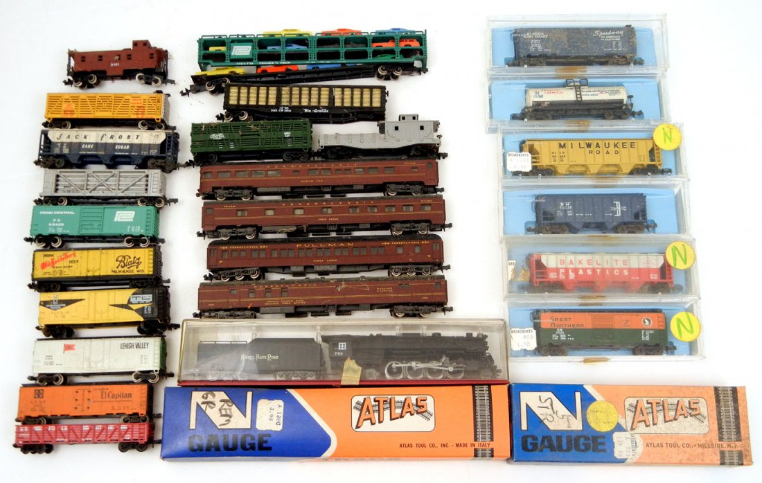 Collection of twenty-five N gauge trains and track: Collection of twenty-five N gauge trains and track, most by Atlas, one Bachmann, one Rapido, some in original boxes