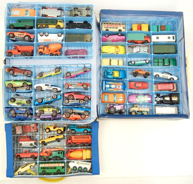 Grouping of sixty-five collectible cars: Grouping of sixty-five collectible cars in two Matchbox "Lesney" cases, including seventeen Hot Wheels redline cars, Matchbox Lesney cars, Corgi Juniors, Majorette, and Aurora cars